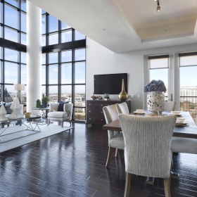 Gorgeous natural light in your living space a large room with a large table and chairs