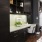 a kitchen with black cabinets