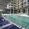 a swimming pool with lounge chairs