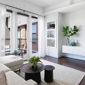 Relax and unwind in well-lit living areas a living room with a couch and a table