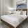 a bedroom with a bed and a table
