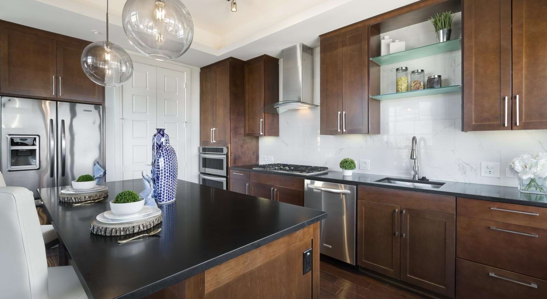 a kitchen with a black countertop