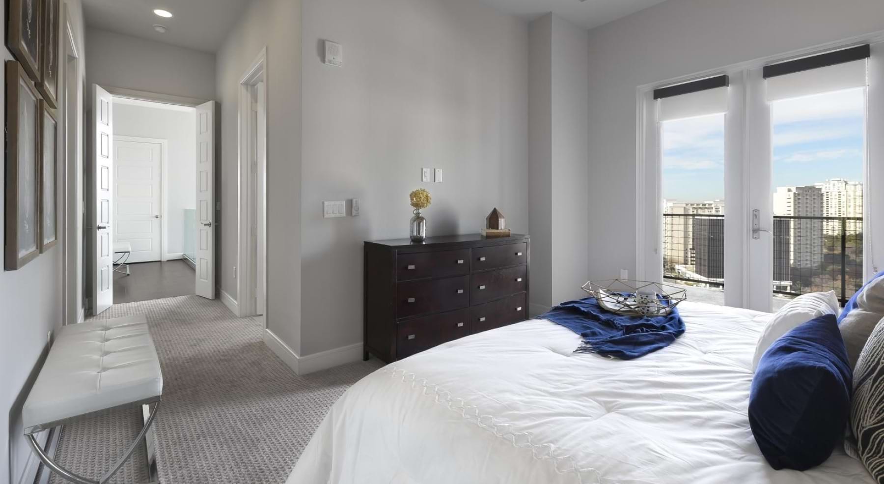 a bedroom with a large window