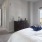 a bedroom with a large window