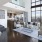 a modern looking living room with a large glass window