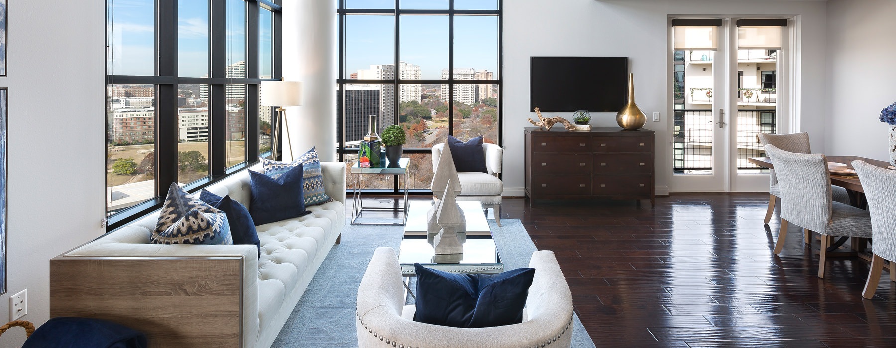 living room with couch and large windows