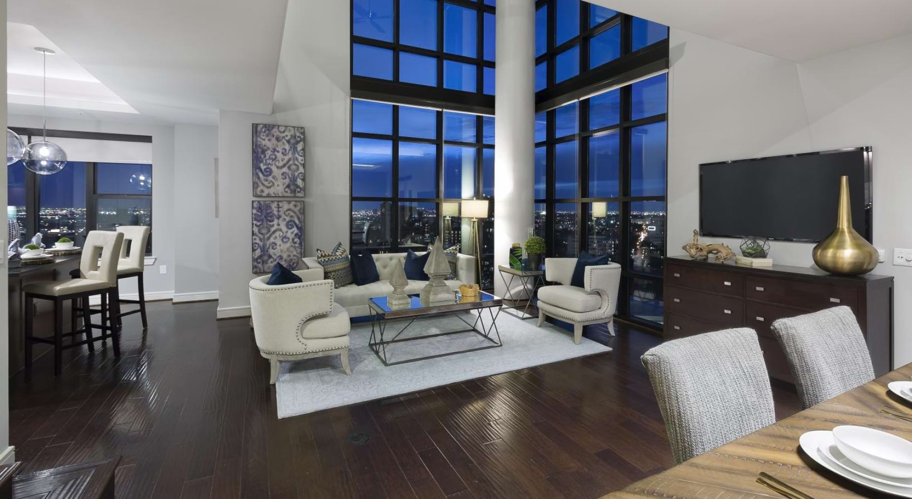 a room with a large window and chairs