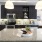 a kitchen with black cabinets